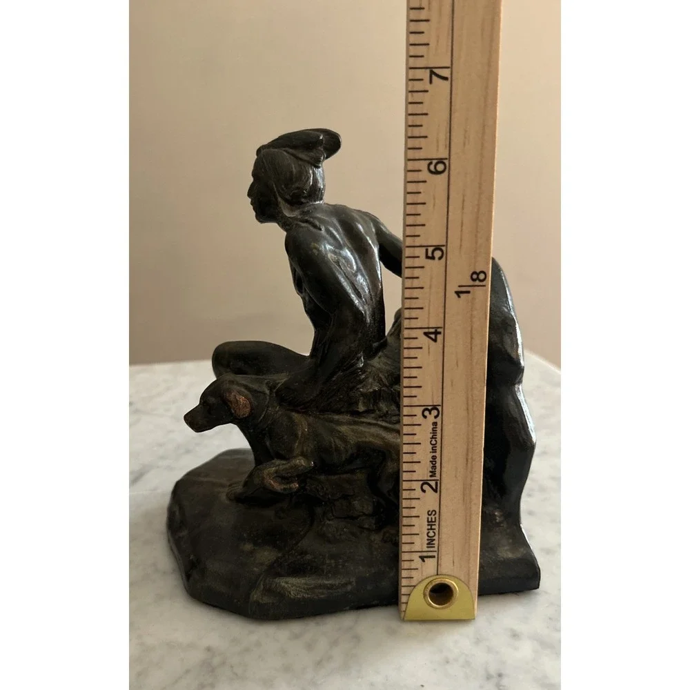 Antique Meal metal cast Indian bookends. Good condition.